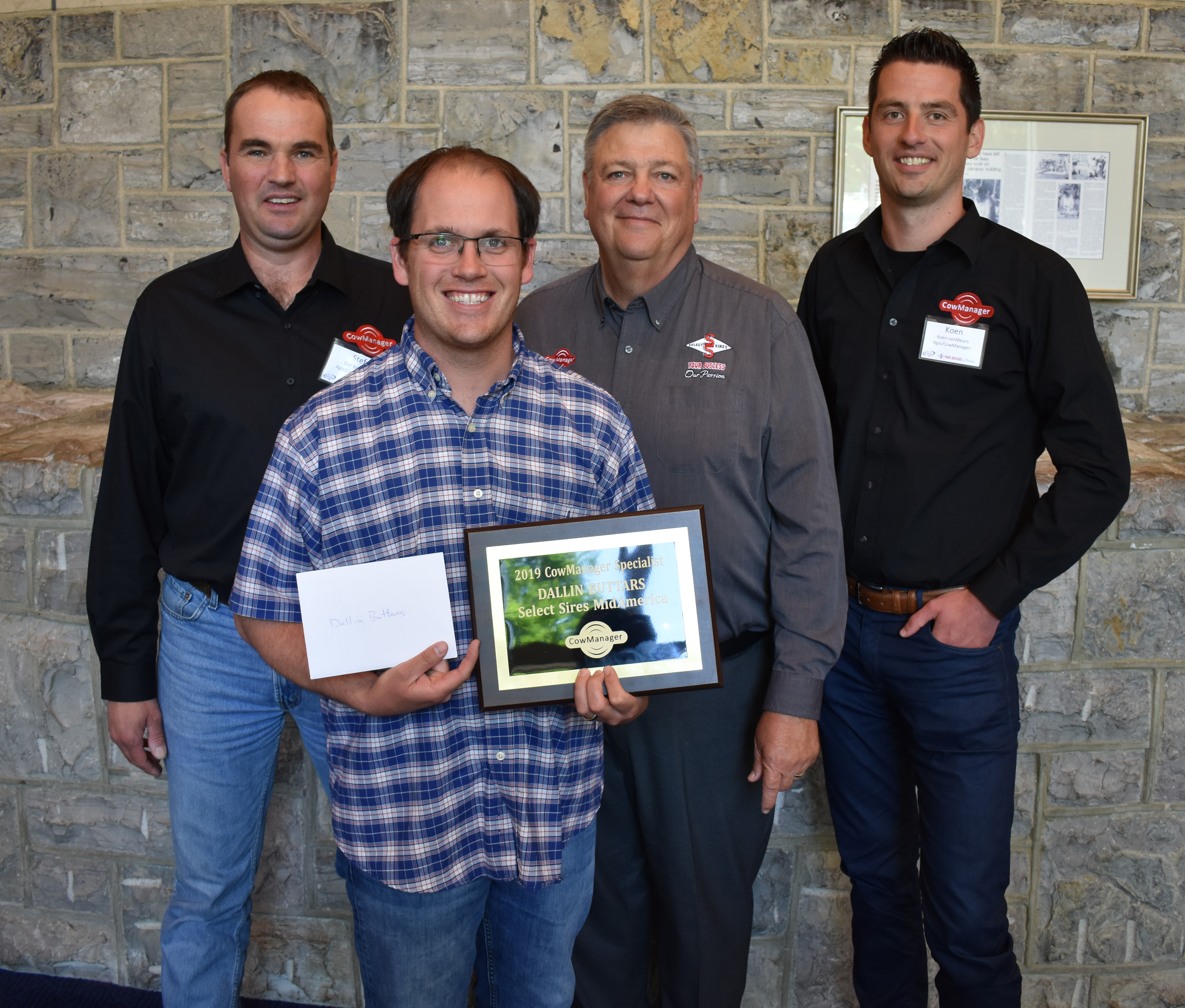 Dallin Buttars, Logan, Utah, receives the 2019 CowManager Specialist of the Year award from Select Sires’ Dr. Ray Nebel and representatives from CowManager.